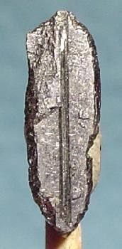 Meneghinite