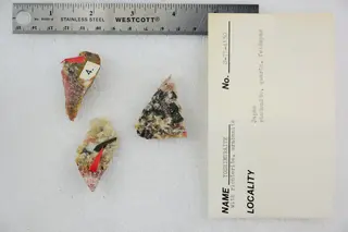 Yoshimuraite with Richterite, Urabanite, Rhodonite, Quartz, and Feldspar (48603224601).jpg