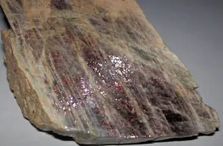 Anorthoclase feldspar with iridescent hematite inclusions (Potanikha Quarry, Kasli, Ural Mountains, Russia) 3 (29991299092).jpg