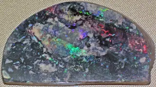 Precious opal in matrix (Quilpe, Queensland, Australia) 2 (26554894833).jpg