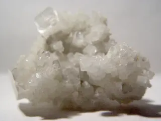 Hydroxyapophyllite on white background.jpg