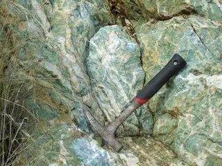 Mariposite Rock at Well Known Road Cut in Mariposa County near Coulterville, California.jpg