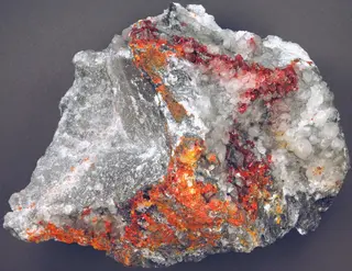 Realgar & pararealgar & calcite on marble (Middle Eocene mineralization, 39 Ma; Getchell Mine, northern Osgood Mountains, northern Nevada, USA) 1 (18719248190).jpg